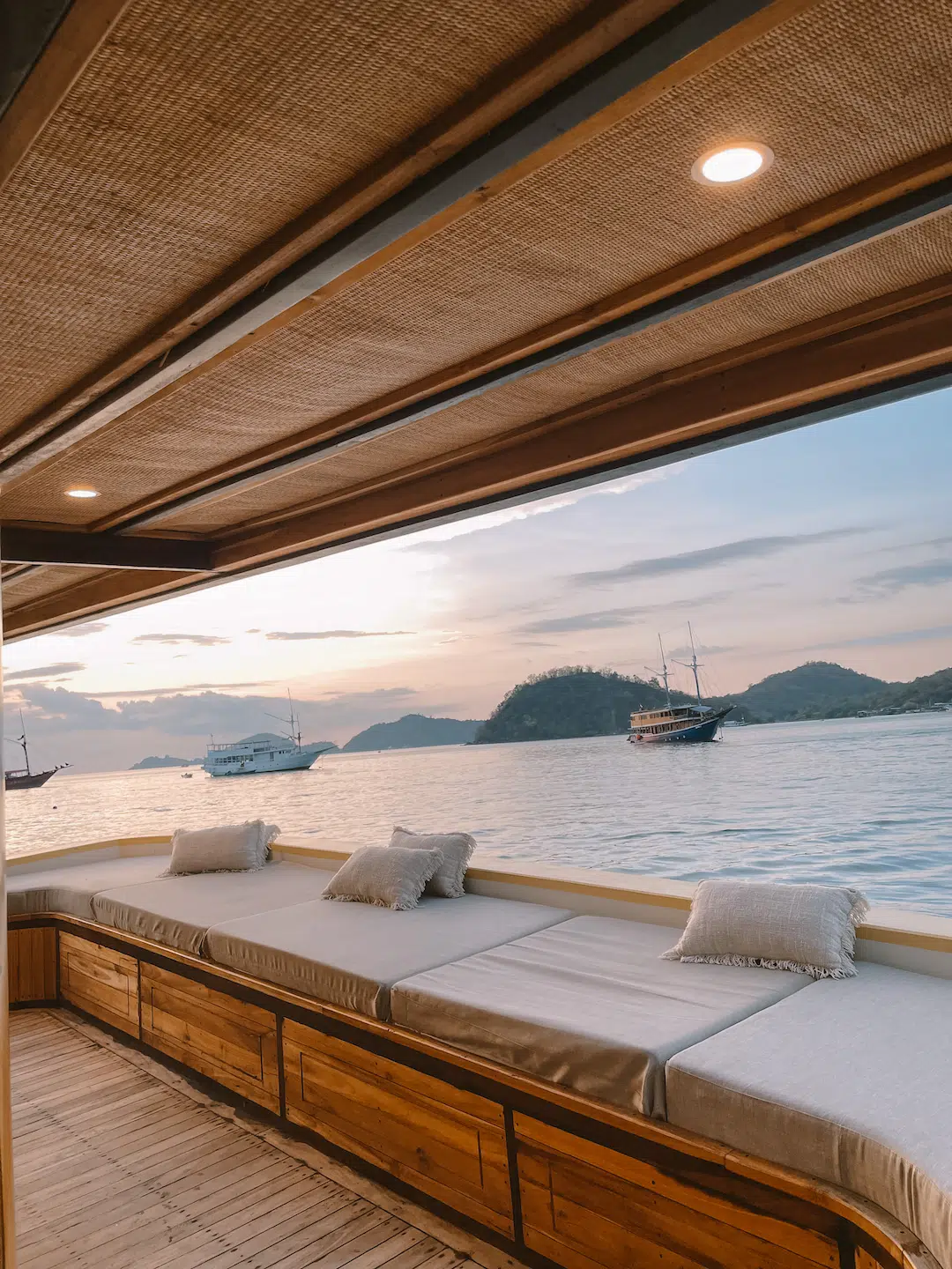 Private sundeck on the Phinisi charter — Komodo at golden hour